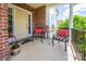 Inviting front porch with comfortable seating and a welcoming entrance with potted plants at 7245 Willow Brook Ct, Denver, NC 28037