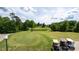 Scenic golf course view with lush greenery, a pond, and golf carts at 7245 Willow Brook Ct, Denver, NC 28037