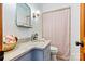 Cozy bathroom featuring a granite-topped vanity, stylish mirror, and a shower with curtain at 8218 Bright Water Ln, Denver, NC 28037