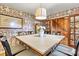 Charming dining room with vintage wallpaper, wooden floors, and a large table for Gathering meals at 8218 Bright Water Ln, Denver, NC 28037