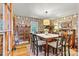 Formal dining room with vintage wallpaper, a large table, and ample seating, perfect for gatherings at 8218 Bright Water Ln, Denver, NC 28037
