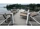 Wooden dock featuring outdoor seating areas and stunning lake views at 8218 Bright Water Ln, Denver, NC 28037