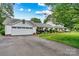 Beautiful home with an attached two car garage, long driveway, meticulously manicured lawn and mature landscaping at 8218 Bright Water Ln, Denver, NC 28037