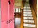Inviting foyer with a numbered staircase and a glimpse into a bright, open living space at 8218 Bright Water Ln, Denver, NC 28037