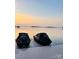 View of jet skis on a private dock at sunset with picturesque lake views at 8218 Bright Water Ln, Denver, NC 28037