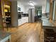 A bright, airy kitchen featuring white cabinets and stainless steel appliances at 8218 Bright Water Ln, Denver, NC 28037