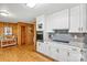 Beautiful kitchen with white cabinetry, stainless steel appliances, and stylish backsplash for cooking at 8218 Bright Water Ln, Denver, NC 28037