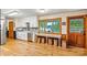 Modern kitchen with white cabinets, wooden floors, and a view of the lake, ideal for entertaining at 8218 Bright Water Ln, Denver, NC 28037