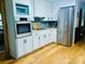 Modern kitchen with stainless steel appliances, custom cabinetry, and sleek countertops at 8218 Bright Water Ln, Denver, NC 28037