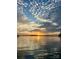 Picturesque sunset over the lake featuring a serene view of the calm waters and colorful sky at 8218 Bright Water Ln, Denver, NC 28037