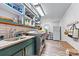 Functional laundry room with shelving, modern appliances, and a workspace at 8218 Bright Water Ln, Denver, NC 28037