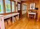 Inviting living room boasts wood paneled walls and a built-in bar, great for entertaining at 8218 Bright Water Ln, Denver, NC 28037