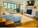 Beautiful living room with a brick fireplace and a large window with lake views at 8218 Bright Water Ln, Denver, NC 28037