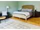 Spacious primary bedroom with a sitting area, rug, and natural light at 8218 Bright Water Ln, Denver, NC 28037
