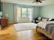 Primary bedroom showcasing a window, a sleek rug, and a cozy seating area at 8218 Bright Water Ln, Denver, NC 28037