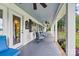 Spacious, covered porch with comfortable seating, ideal for relaxing and enjoying the outdoor views at 8218 Bright Water Ln, Denver, NC 28037