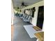 Inviting front porch with stylish seating and a ceiling fan for added comfort at 8218 Bright Water Ln, Denver, NC 28037