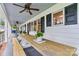 Inviting front porch with ceiling fans and ample seating, perfect for enjoying outdoor living at 8218 Bright Water Ln, Denver, NC 28037