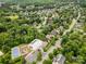 Aerial view of a neighborhood community featuring a pool, tennis court, and lush greenery at 8962 Landsdowne Ave, Harrisburg, NC 28075