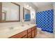 Bathroom showing a double sink vanity and tub with shower at 8962 Landsdowne Ave, Harrisburg, NC 28075