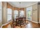 Charming dining area with natural light and an elegant table and chairs set at 8962 Landsdowne Ave, Harrisburg, NC 28075