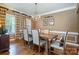 Classic dining room showcasing a wooden table, chandelier, and elegant decor at 8962 Landsdowne Ave, Harrisburg, NC 28075