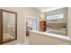 Upstairs hallway featuring a reading nook and stairway at 8962 Landsdowne Ave, Harrisburg, NC 28075