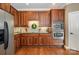 Well-appointed kitchen with stainless steel appliances, granite countertops, and wooden cabinetry at 8962 Landsdowne Ave, Harrisburg, NC 28075