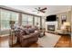 Cozy living room filled with natural light, fireplace and plush seating at 8962 Landsdowne Ave, Harrisburg, NC 28075