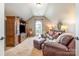 Upper level living room featuring vaulted ceiling and comfortable leather seating at 8962 Landsdowne Ave, Harrisburg, NC 28075