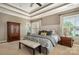Comfortable main bedroom features a plush, neutral-toned carpet and stylish furniture at 8962 Landsdowne Ave, Harrisburg, NC 28075