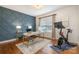 Stylish office with desk, Peloton bike, and modern wainscoting at 8962 Landsdowne Ave, Harrisburg, NC 28075