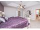 Spacious bedroom featuring trey ceiling, ceiling fan, and white dresser with ornate mirror at 9026 Raven Top Dr, Mint Hill, NC 28227