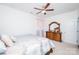 Bright bedroom with modern furniture, neutral color palette, ceiling fan, and natural light at 9026 Raven Top Dr, Mint Hill, NC 28227