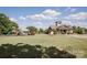 Community clubhouse and playground area featuring a vast lawn and a classic playground structure at 9026 Raven Top Dr, Mint Hill, NC 28227