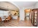 Open-concept dining area connects to a modern kitchen and a staircase, perfect for entertaining at 9026 Raven Top Dr, Mint Hill, NC 28227