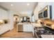 Modern kitchen equipped with stainless steel appliances, granite countertops, and an open layout for easy entertaining at 9026 Raven Top Dr, Mint Hill, NC 28227
