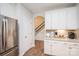 Well-lit kitchen includes stainless steel refrigerator and complements the home's modern design and functionality at 9026 Raven Top Dr, Mint Hill, NC 28227