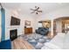 Comfortable living room includes a fireplace, ample seating, and views into the kitchen and foyer at 9026 Raven Top Dr, Mint Hill, NC 28227