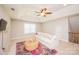 Bright living room with vaulted ceilings, cozy seating, and a decorative rug on the carpeted floor at 9026 Raven Top Dr, Mint Hill, NC 28227