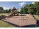 Community playground area with climbing structures, slides, and a wood chip safety ground covering at 9026 Raven Top Dr, Mint Hill, NC 28227
