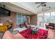 Cozy sunroom with wicker furniture, fireplace, and brick accents, perfect for relaxing at 9026 Raven Top Dr, Mint Hill, NC 28227