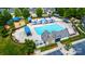 Aerial view of community pool and playground featuring blue umbrellas and ample seating at 9614 Springholm Dr, Charlotte, NC 28278