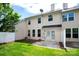 Home exterior showing the backyard with a small patio and grassy area at 9614 Springholm Dr, Charlotte, NC 28278