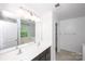 Bathroom with double sinks, large mirror, and separate tub and shower at 9614 Springholm Dr, Charlotte, NC 28278