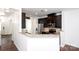 Modern kitchen with granite countertops, stainless steel appliances, and dark cabinetry at 9614 Springholm Dr, Charlotte, NC 28278