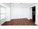 Spacious living room with hardwood floors, large windows, and natural lighting at 9614 Springholm Dr, Charlotte, NC 28278