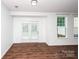 Bright living room with wood floors, neutral walls and sliding glass doors at 9614 Springholm Dr, Charlotte, NC 28278