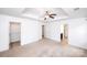 Main bedroom with neutral walls, carpeted floor, and multiple entries at 9614 Springholm Dr, Charlotte, NC 28278