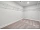 Spacious walk-in closet with ample shelving, offering efficient storage solutions and organization at 9944 Manor Vista Trl, Kannapolis, NC 28027